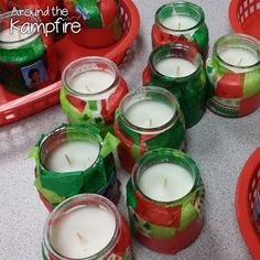 many candles are wrapped in green and red paper