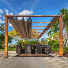 an outdoor dining area with tables and chairs