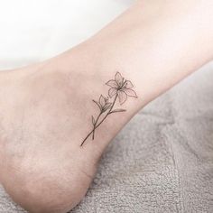 a small flower tattoo on the ankle is one of the most popular tattoos for women