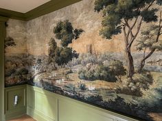 a wall with a painting on it in a room