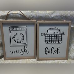 two framed signs that say wash and fold