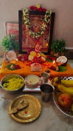 the altar is decorated with flowers and fruit for diwaling or offering to god