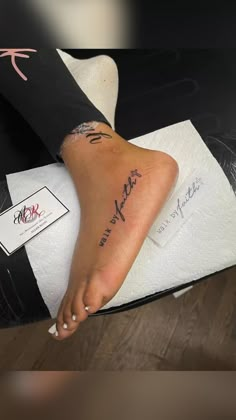 a woman's foot with her name tattooed on it