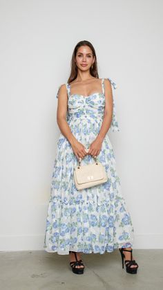 Indulge in the epitome of elegance with this delicate floral maxi dress adorned with a mesmerizing floral white design. Features: Maxi Floral Princess Seam Model is wearing a small 81380 A9-3 White Floor-length Midi Dress For Spring, White Floor-length Dress For Day Out, Elegant Floral Midi Dress For Beach, Elegant Midi Length Floral Beach Dress, Feminine Long Floral Dress For Garden Party, Feminine Floral Dress For Garden Party, Feminine Floral Maxi Dress For Garden Party, Floral Print Sundress Midi Dress For Wedding, Floral Print Sundress For Weddings