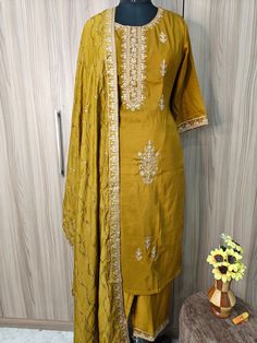 Indian Wedding Wear Salwar Kameez / Indian Ethnic Dress / Plus Size Silk Kurta Dress Traditional Indian Wear / Salwar Kameez Dupatta / Kurti Palazzo Set / Party Wear/ Silk Kurta Set Item Details Mustard Embroidered Kurta Trousers & Dupatta KURTA Neck : Round Neck Sleeves : 3/4 Sleeves Fabric : Silk Blend Work Type : Embroidered Length : 46" PANT Pant style : Embroided trouser with elastic waist Band Fabric : Silk Blend length : 37" DUPATTA Fabric : Organza Length : 2meter Wash Care : Hand Wash S Kurta Sets For Women, Kurti Palazzo Set, Kurti Palazzo, Dress Traditional, Kurta Dress, Palazzo Set, Indian Wedding Wear, Silk Kurta, Ethnic Dress