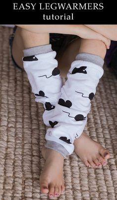 the legs and feet of a child wearing leg warmers