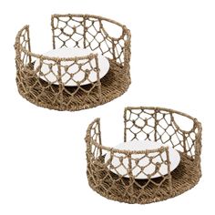 two wicker baskets with white plates on them