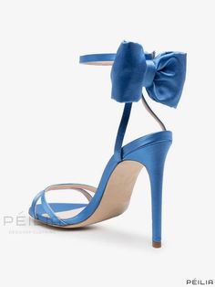 Blue High Heels With Bow, Blue Bow Sandals For Spring, Formal Light Blue Open Toe Sandals, Elegant Light Blue Ankle Strap Sandals, Blue Sandals With Heel Strap For Party, Chic Blue Sandals For Wedding, Light Blue Open Toe Heels For Party, Blue Party Sandals With 4-inch Heel, Formal Light Blue Sandals With Padded Heel