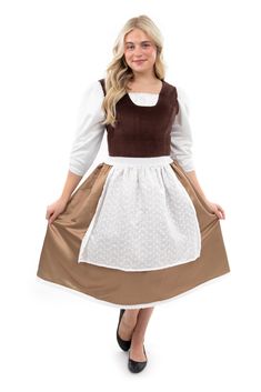 a woman wearing a dress with brown and white trims, standing in front of a white background