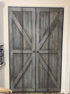 a large wooden door in the corner of a room