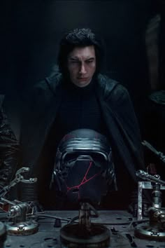 the star wars character is surrounded by metal objects and other things in front of him