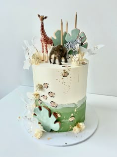 there is a cake decorated with animals on it