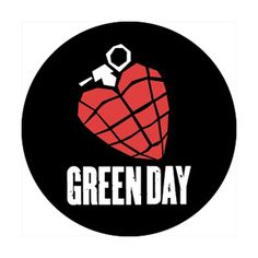 a patch with the words green day on it and a heart holding a key in its mouth