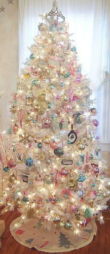 a white christmas tree in a living room