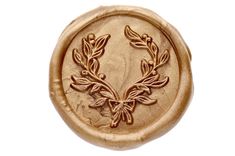 a wax seal with an image of leaves and berries on it's front side