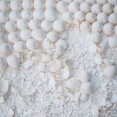 an arrangement of white eggs on top of each other