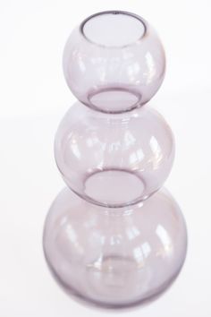 three clear vases stacked on top of each other