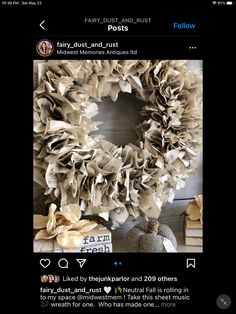 an image of a wreath made out of old newspaper paper on the front of a door