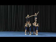 a group of young women standing on top of each other