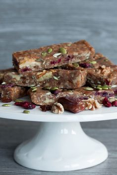 a white cake plate topped with granola bars