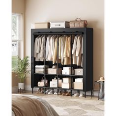 an organized closet with clothes, shoes and bags on the shelves next to a bed