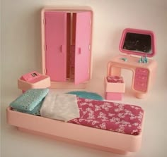 a dollhouse bedroom with pink furniture and accessories