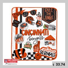 an orange and white blanket with the word cincinnati on it, surrounded by various sports related items