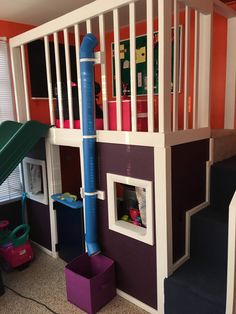 a child's bedroom with bunk bed and slide