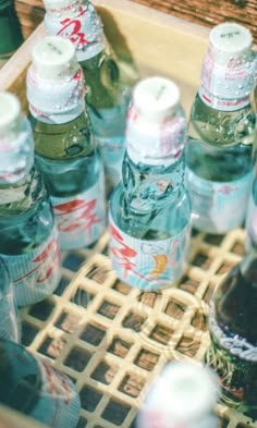 several bottles of soda sit on a tray