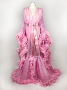 Beautiful chiffon dressing gown in Baby Pink.  Trimmed along the hem and the sleeve edges with fluffy chandelle feathers.  Ties around the waist with a matching chiffon belt - not satin as pictured! One size fits all due to the design and fullness of the robe.  Perfect for family gatherings, walking the dogs as well as taking out the rubbish.  Please expect some feathers to shed - no one can look this fabulous without losing a few feathers. Walking The Dogs, Fancy Robes, Diy Luxury, Pink Bow Dress, Feather Gown, Runway Gowns, Night Fashion, Baby Rosa, Pink Costume