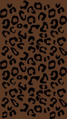 a black and brown animal print pattern on a brown background with the letter s in it's center