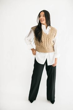 Sweater vests are all the rage and we have the perfect one for you! Our Caroline sweater vest features a v-neckline and cable knit detail in a dreamy mocha color. It is cozy and chic all in one. model is wearing a small. Height 5'6", Bust 34", Waist 27", Hip 37" Size Chart Size & Fit Size S - length measures 19" from shoulder to hem. Bust 34" Size M- length measures 20" from shoulder to hem. Bust 36" Size L - length measures 21" from shoulder to hem. Bust 38" V-neck Cable Knit Outerwear For Layering, Beige Cable Knit V-neck Top, Casual V-neck Cable Knit Sweater Vest, V-neck Knit Vest For Work, Brown Knit Sweater Vest For Work, Cozy V-neck Sweater Vest For Fall, Beige Sweater Vest For Workwear In Fall, Elegant Brown V-neck Vest, Chic Chunky Knit Sweater Vest For Fall