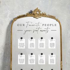 a gold framed mirror with seating cards attached to the front and back of it that says our favorite people, your special guests