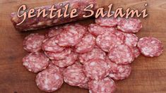 several pieces of salami on a cutting board with the words gentile salami above it