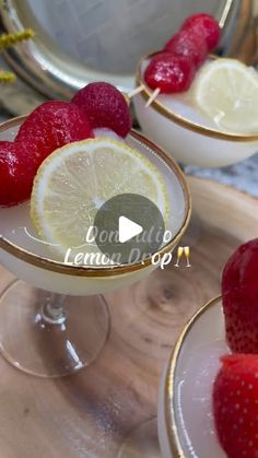 two glasses filled with lemonade and strawberries