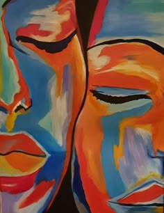 two faces painted in different colors and shapes