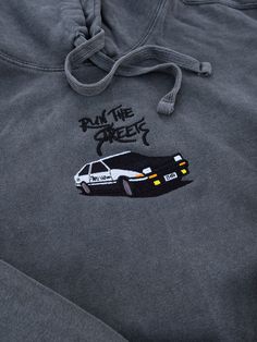 Get our drift legend 'AE86' embroidered graphic on your choice from t-shirt or hoodie. Embroidery is done in-house. Made with sustainably and fairly grown USA cotton. Direct embroidery, only available here at Run The Streets Shop! * 4" embroidered graphic. * T-shirts are 100% cotton. * Hoodies are 80% cotton/20% polyester. * True to size, classic fit. (measurements in photos) * Free shipping, ships in poly-bag (more options at checkout). T-Shirt Version: ➡ https://etsy.com/listing/1681794726 Emb Affordable Streetwear Hoodie With Embroidered Text, Hoodie Photo Ideas, Hoodies Embroidery, Ae86 Trueno, Hoodie Embroidery, Clothes Embroidery Diy, Cotton Hoodies, Shirt Design Inspiration