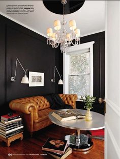 a living room filled with furniture and a chandelier