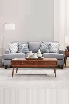 a living room scene with focus on the couch and coffee table