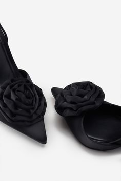 Designed for maximum impact. our Clearly pumps have been crafted in an eye-catching sumptuous black satin. These pointed-toe heels showcase a floral corsage and are detailed with a lace-up fastening and open-arch design. Completed with soft padded soles. Clearly are the perfect finishing touch to any outfit. Features - Premium satin - Floral corsage detail- Pointed toe- Open arch- Lace-up fastening - Stiletto heel - Heel height: 3.9in/10cm Product Information Designed exclusively by Club L Londo Heels With Flowers, Floral Corsage, Arch Design, Pointed Toe Heels, Polyester Satin, Bridal Shop, Stiletto Heel, Black Satin, Trending Accessories