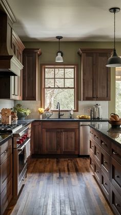 a kitchen with wooden floors and brown cabinets