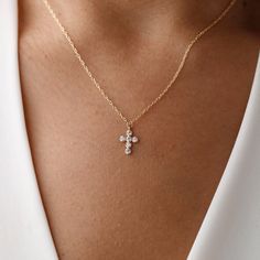 Introducing our Tiny Cross Necklace--a delicate and meaningful accessory that blends faith with elegance. This petite necklace features a finely crafted cross pendant, offering a subtle and timeless expression of spirituality. Meticulously designed with high-quality materials, it ensures both durability and style. Perfect for everyday wear or as a thoughtful gift, the Tiny Cross Necklace is a symbol of faith in a minimalist form, adding a touch of grace to your neckline. Embrace the simplicity and significance of this exquisite piece DETAILS: ❥Material: 925k sterling silver ❥Color: Silver, Gold, Rose Gold ❥Finish: Polished ♡ You can choose from several lengths of necklaces: 14", 16", 18", 20", 22" - during your order you can select your preferred necklace length from the dropdown menu. ♡ H Dainty Cross Necklace, Tiny Cross Necklace, Petite Necklace, Diamond Cross Necklace, Tiny Cross, Diamond Cross Necklaces, Necklace Diamond, Diamond Cross, Religious Jewelry