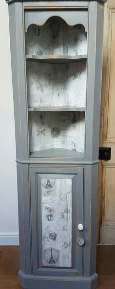 an old china cabinet painted in blue and white