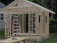 a house being built with wooden framing and ladders on the front porch, next to a work bench