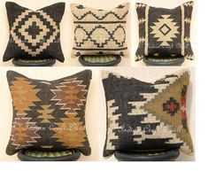 four pillows with different designs on them, one is brown and the other is black