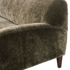 a close up view of the back end of a couch with dark brown fabric and wood legs