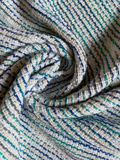 a close up shot of a blue and green striped fabric