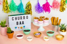 a table topped with lots of food and confetti