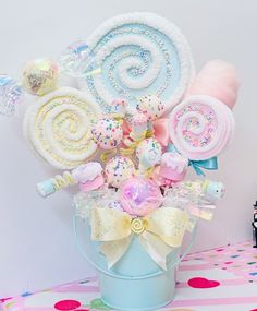 a basket filled with lots of candy and lollipops on top of a table