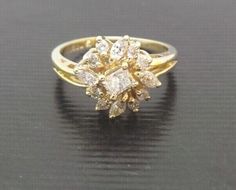 a yellow gold ring with diamonds on it